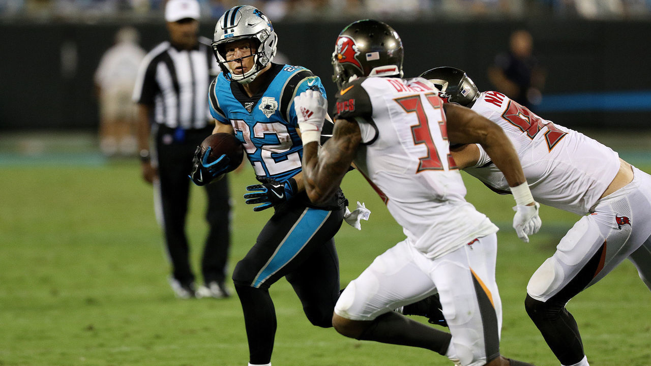 CHARLOTTE, NC - SEPTEMBER 12: Christian McCaffrey (22) running back of Carolina looks to out run some Buccanners defenders during a NFL football game between the Tampa Bay Buccaneers and the Carolina Panthers on September 12, 2019, at Bank of America Stadium in Charlotte, N.C.