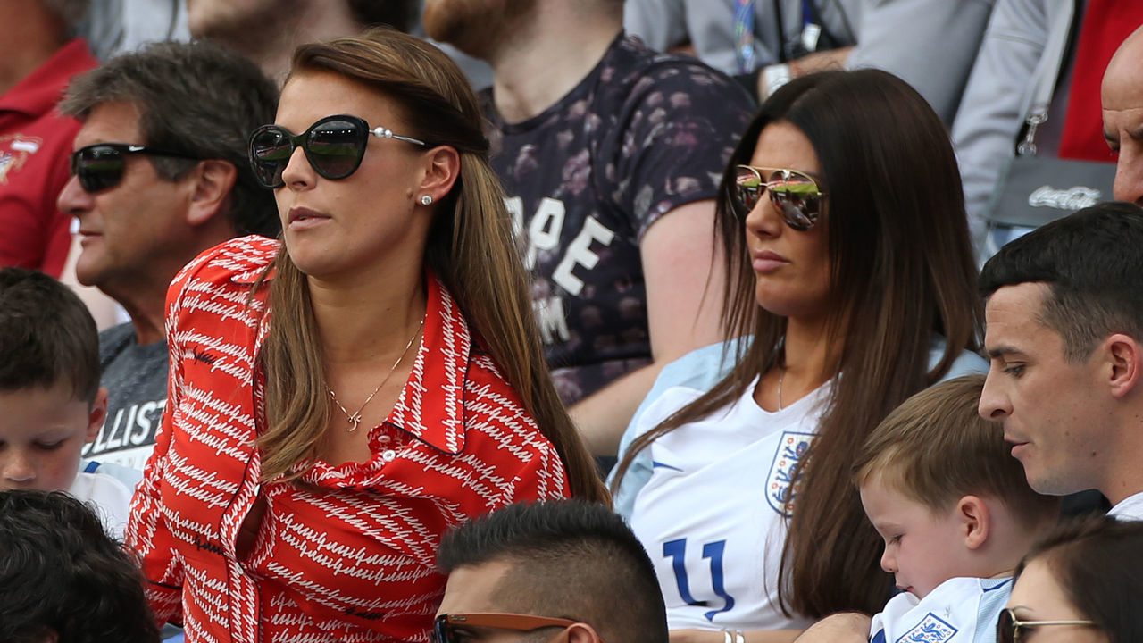 LENS, FRANCE - JUNE 16: Coleen Rooney, wife of Wayne Rooney, with their sons Kai Rooney (left) and Klay Rooney sit in front of Rebekah Vardy, wife of Jamie Vardy during the UEFA EURO 2016 Group B match between England v Wales at Stade Bollaert-Delelis on June 16, 2016 in Lens, France.