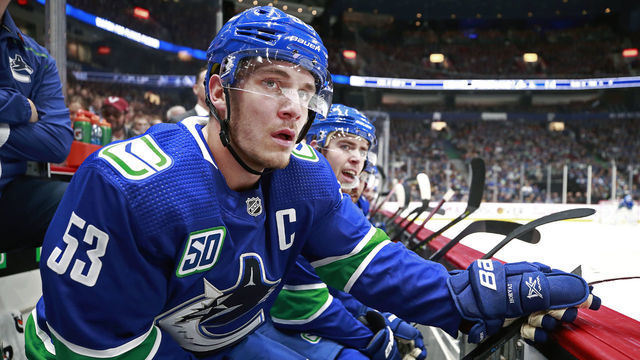 VANCOUVER, BC - OCTOBER 9: Bo Horvat #53 of the Vancouver Canucks sports a C as be looks on from the bench during their NHL game against the Los Angeles Kings at Rogers Arena October 9, 2019 in Vancouver, British Columbia, Canada.