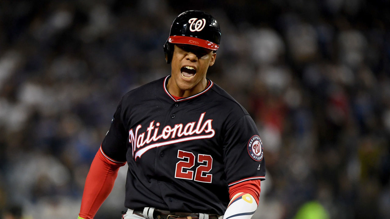 LOS ANGELES, CALIFORNIA - OCTOBER 09: Juan Soto #22 of the Washington Nationals celebrates after his solo home run to tie the game 3-3 in the eighth inning of game five of the National League Division Series against the Los Angeles Dodgers at Dodger Stadium on October 09, 2019 in Los Angeles, California.