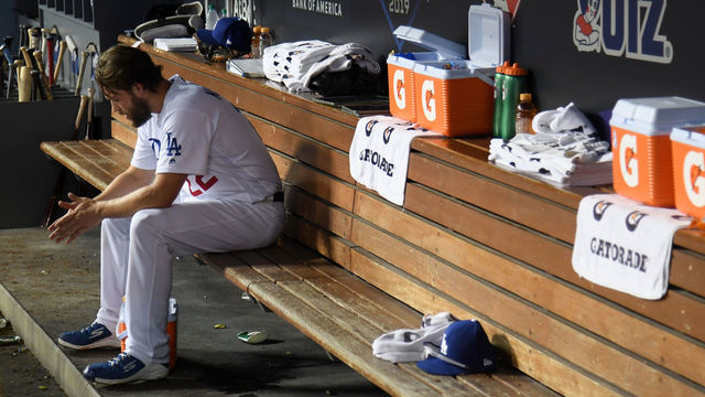 LOS ANGELES, CALIFORNIA - OCTOBER 09: Clayton Kershaw #22 of the Los Angeles Dodgers sits in the dug out after leaving the game after giving up back to back home runs in the eighth inning of game five of the National League Division Series against the Washington Nationals at Dodger Stadium on October 09, 2019 in Los Angeles, California.