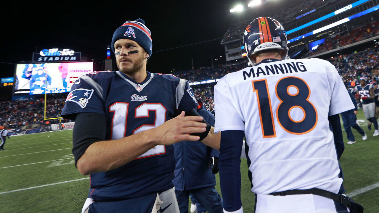 FOXBOROUGH, MA - NOVEMBER 2: As the final 15 seconds tick off the clock, Broncos quarterback Peyton Manning, left, and Tom Brady, right, meet quickly, shook hands even quicker and then they separated. The New England Patriots hosted the Denver Broncos in a regular season NFL game at Gillette Stadium.