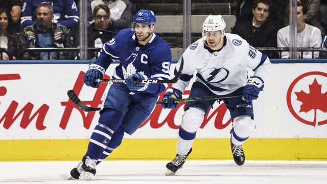 TORONTO, ON - OCTOBER 10: John Tavares #91 of the Toronto Maple Leafs skates against Erik Cernak #81 of the Tampa Bay Lightning during the second period at the Scotiabank Arena on October 10, 2019 in Toronto, Ontario, Canada.
