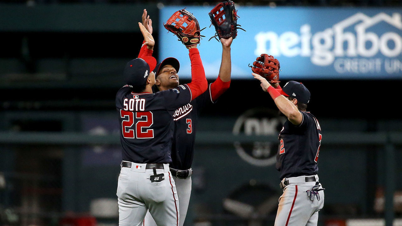 ST LOUIS, MISSOURI - OCTOBER 11: Juan Soto #22, Michael A. Taylor #3 and Adam Eaton #2 of the Washington Nationals celebrate their teams 2-0 win over the St. Louis Cardinals in game one of the National League Championship Series at Busch Stadium on October 11, 2019 in St Louis, Missouri.