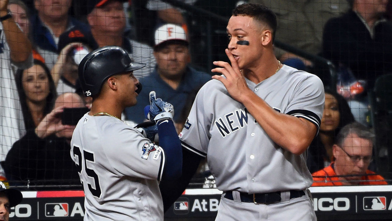 HOUSTON, TX - OCTOBER 12: Gleyber Torres #25 of the New York Yankees is greeted by teammate Aaron Judge #99 after hitting a solo home run in the sixth inning during Game 1 of the ALCS between the New York Yankees and the Houston Astros at Minute Maid Park on Saturday, October 12, 2019 in Houston, Texas.