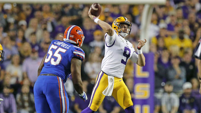 BATON ROUGE, LA - OCTOBER 12: LSU Tigers quarterback Joe Burrow (9) passes against Florida Gators defensive lineman Kyree Campbell (55) on October 12, 2019 at the Tiger Stadium in Baton Rouge, LA.