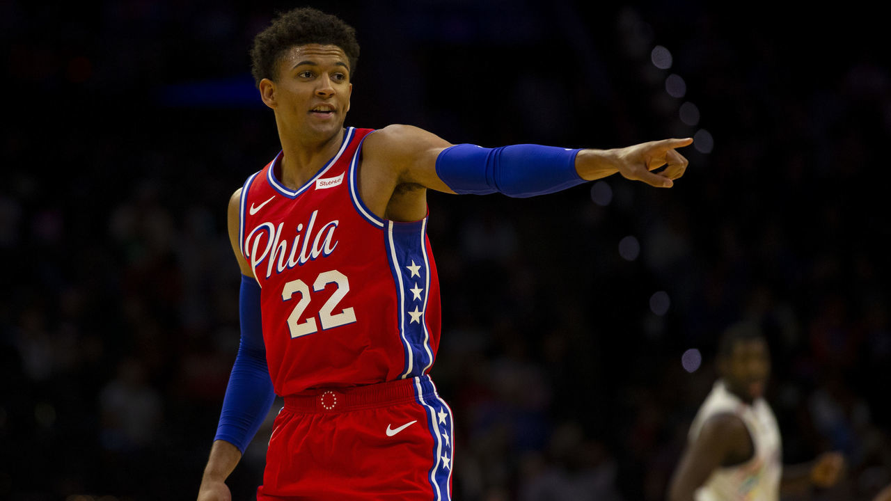 PHILADELPHIA, PA - OCTOBER 08: Matisse Thybulle #22 of the Philadelphia 76ers points against the Guangzhou Long Lions during the preseason game at the Wells Fargo Center on October 8, 2019 in Philadelphia, Pennsylvania.