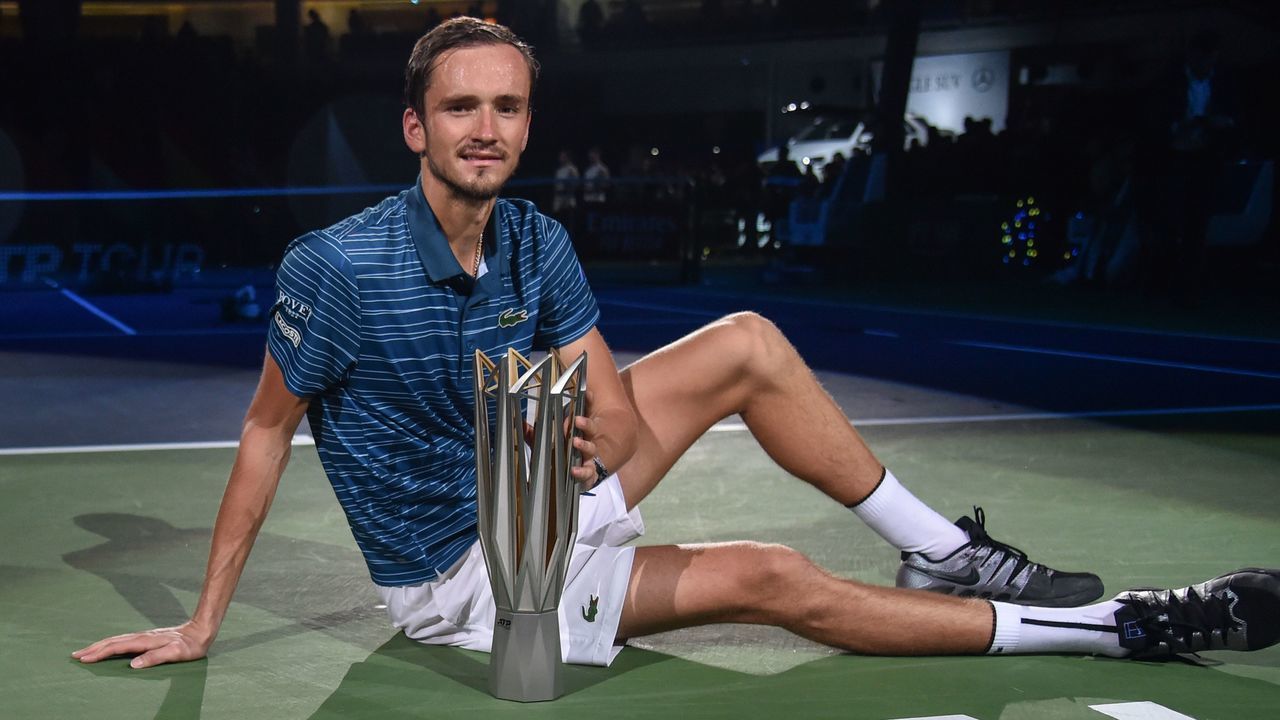 Daniil Medvedev of Russia poses with the trophy after winning the men's singles final over Alexander Zverev of Germany at the Shanghai Masters tennis tournament in Shanghai on October 13, 2019.