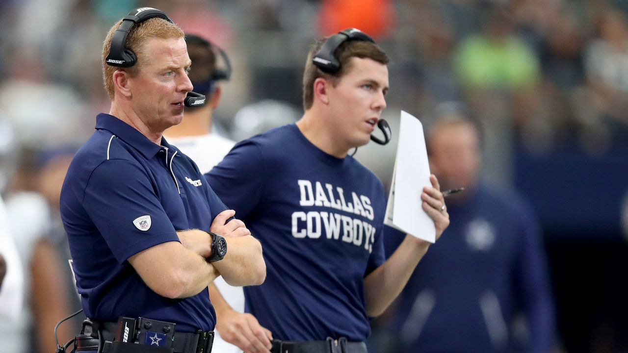 ARLINGTON, TEXAS - SEPTEMBER 22: Offensive coordinator Kellen Moore of the Dallas Cowboys and head coach Jason Garrett of the Dallas Cowboys in action on the sideline against the Miami Dolphins in the second half at AT&T Stadium on September 22, 2019 in Arlington, Texas.
