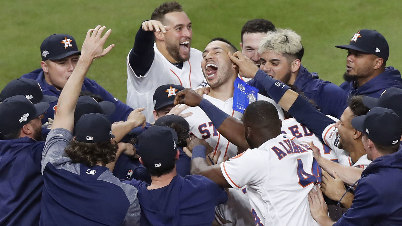 HOUSTON, TX - OCTOBER 13: The Houston Astros celebrate with Carlos Correa #1 after his walk-off solo home run in the 11th inning in game two of the American League Championship Series against the New York Yankees at Minute Maid Park on October 13, 2019 in Houston, Texas.