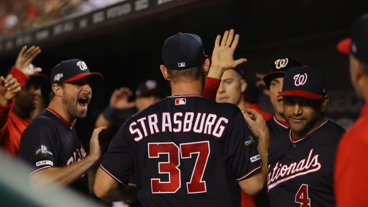 WASHINGTON, DC - OCTOBER 14: Stephen Strasburg #37 of the Washington Nationals is congratulated in the dugout during Game 3 of the NLCS between the St. Louis Cardinals and the Washington Nationals at Nationals Park on Monday, October 14, 2019 in Washington, District of Columbia.