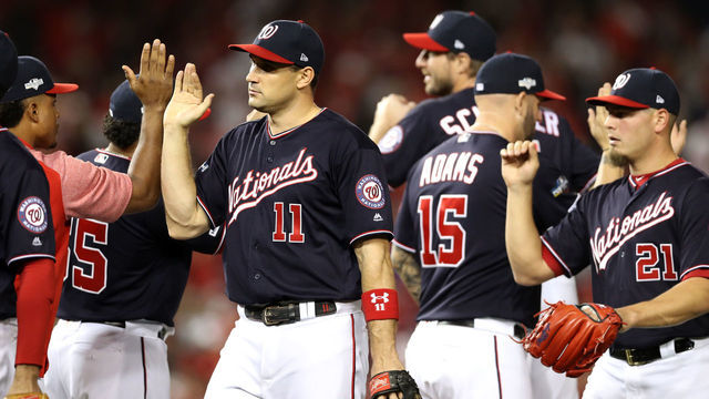 WASHINGTON, DC - OCTOBER 14: Ryan Zimmerman #11 of the Washington Nationals celebrates with teammates after they defeated the St. Louis Cardinals 8-1 in game three of the National League Championship Series at Nationals Park on October 14, 2019 in Washington, DC.