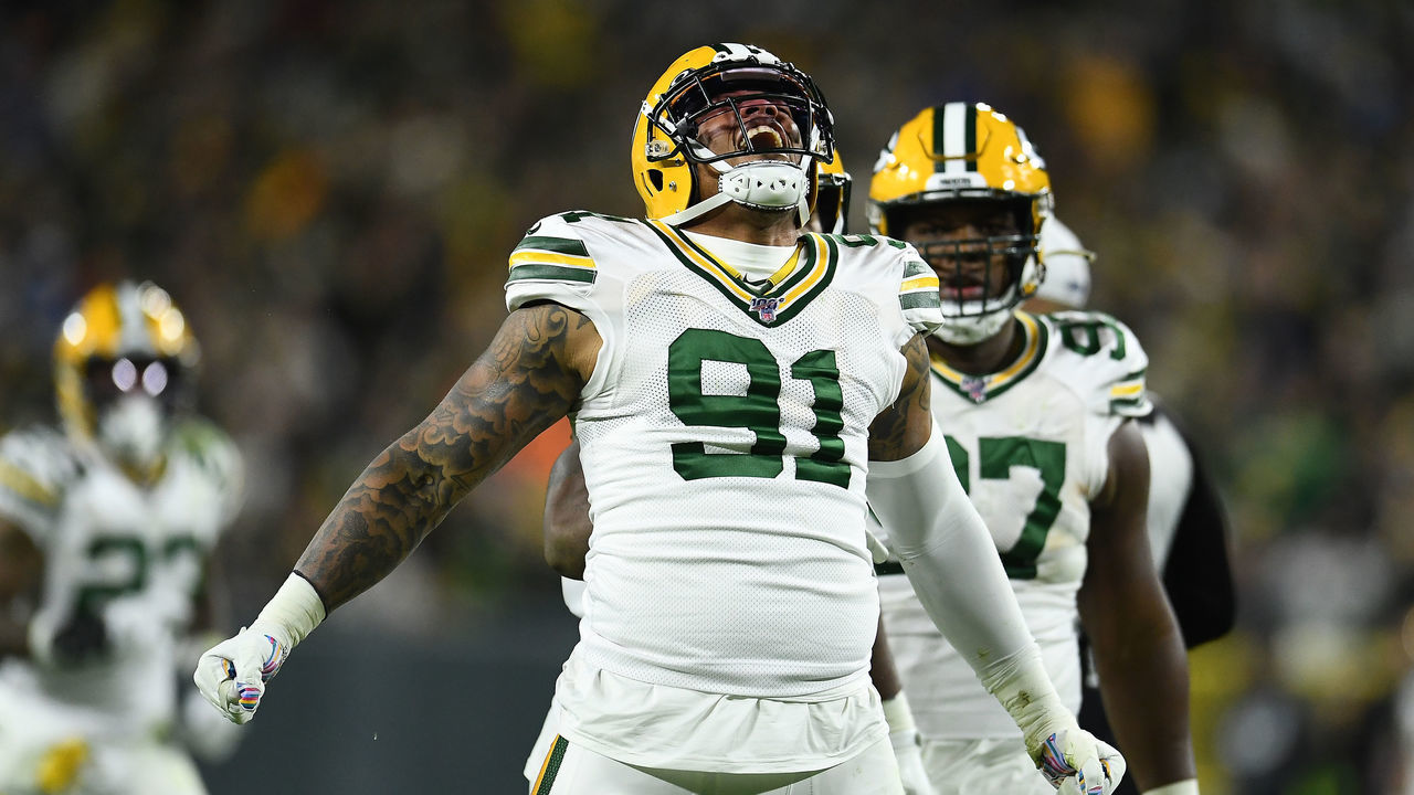 GREEN BAY, WISCONSIN - OCTOBER 14: Preston Smith #91 of the Green Bay Packers reacts to a sack during the second half against the Detroit Lions at Lambeau Field on October 14, 2019 in Green Bay, Wisconsin.