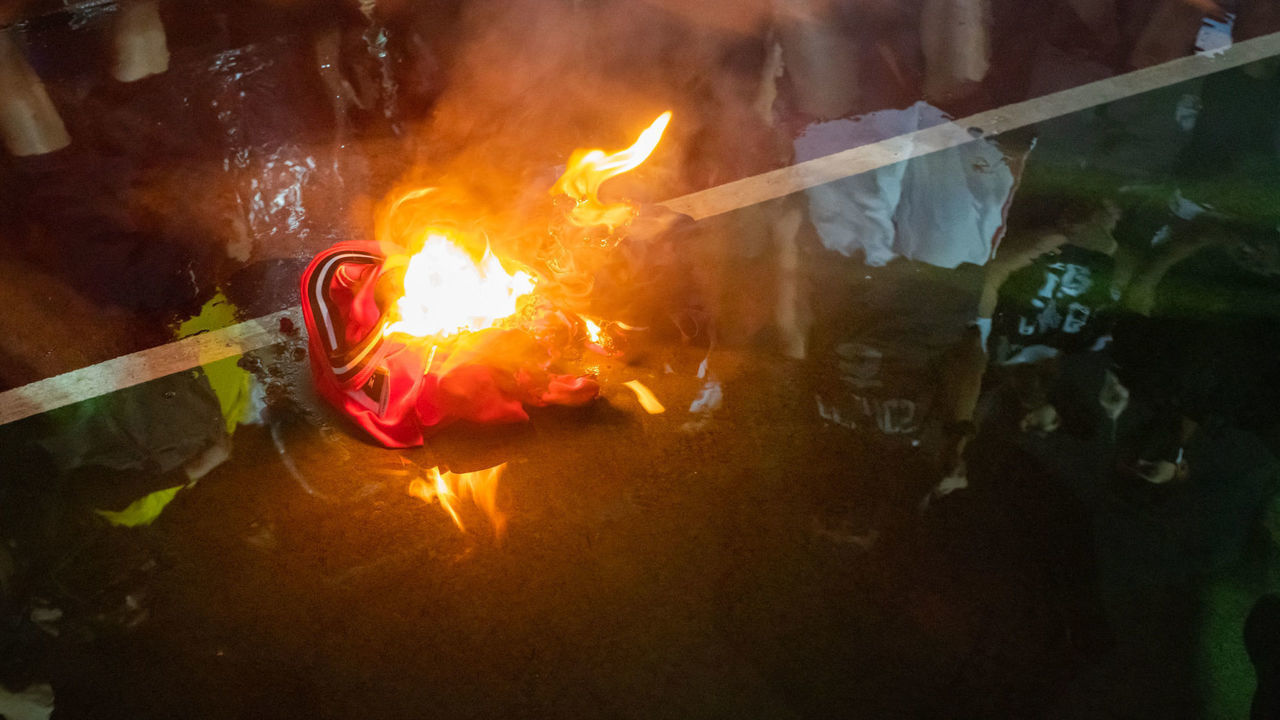 HONG KONG, CHINA - OCTOBER 15: Lebron James jersey burns during a rally at the Southern Playground in support of NBA's Houston Rockets' team general manager Daryl Morey, who sent a tweet backing the pro-democracy movement on October 15, 2019 in Hong Kong, China. Anti-government demonstrations in Hong Kong stretched into its fifth month after the Chinese territory's government invoked emergency powers earlier this month to introduce an anti-mask law. Protesters continue to call for Hong Kong's Chief Executive Carrie Lam to meet their remaining demands since the controversial extradition bill was withdrawn, which includes an independent inquiry into police brutality, the retraction of the word "riot" to describe the rallies, and genuine universal suffrage as the territory faces a leadership crisis.