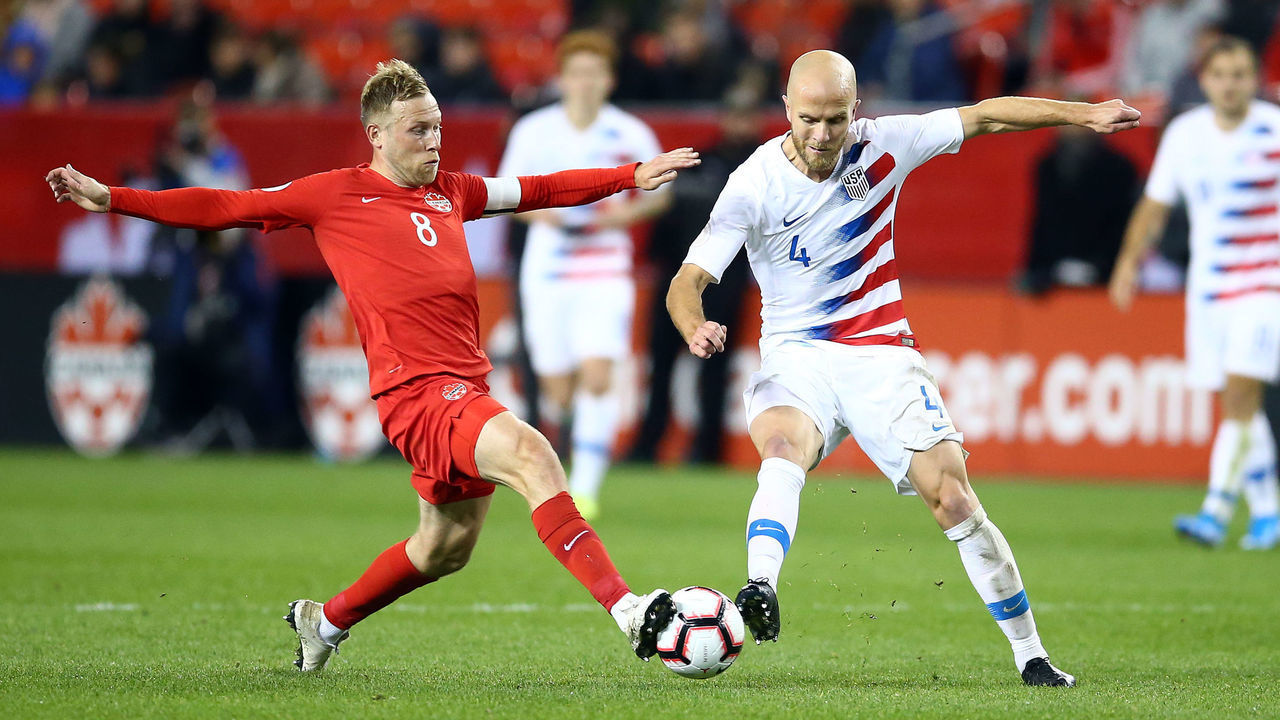 TORONTO, ON - OCTOBER 15: Michael Bradley #4 of the United States battles for the ball with Scott Arfield #8 of Canada during a CONCACAF Nations League game at BMO Field on October 15, 2019 in Toronto, Canada.