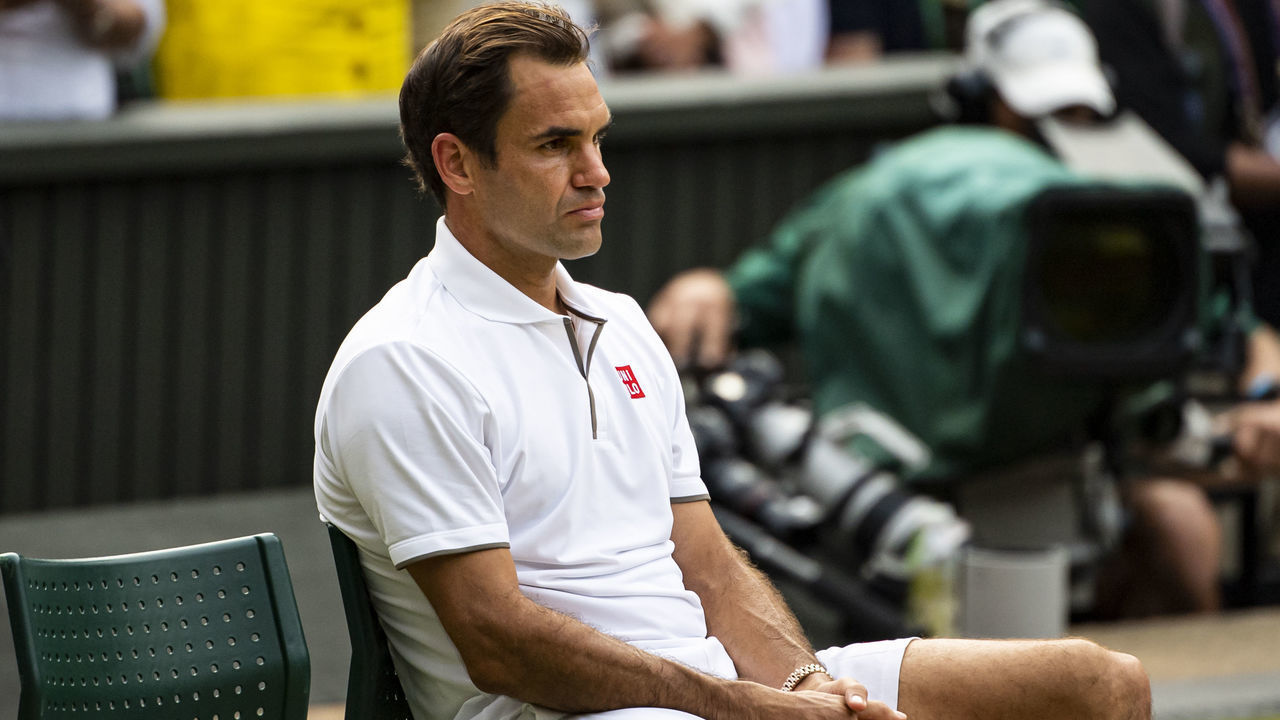 LONDON, ENGLAND - JULY 14: Roger Federer of Switzerland looks dejected after losing against Novak Djokovic of Serbia during Day 13 of The Championships - Wimbledon 2019 at All England Lawn Tennis and Croquet Club on July 14, 2019 in London, England.