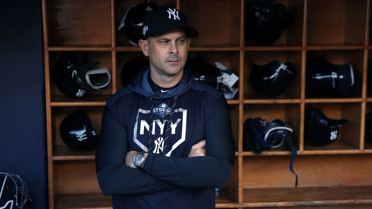 BRONX, NY - OCTOBER 15: New York Yankees manager Aaron Boone #17 looks on from the dugout prior to Game 3 of the ALCS between the Houston Astros and the New York Yankees at Yankee Stadium on Tuesday, October 15, 2019 in the Bronx borough of New York City.