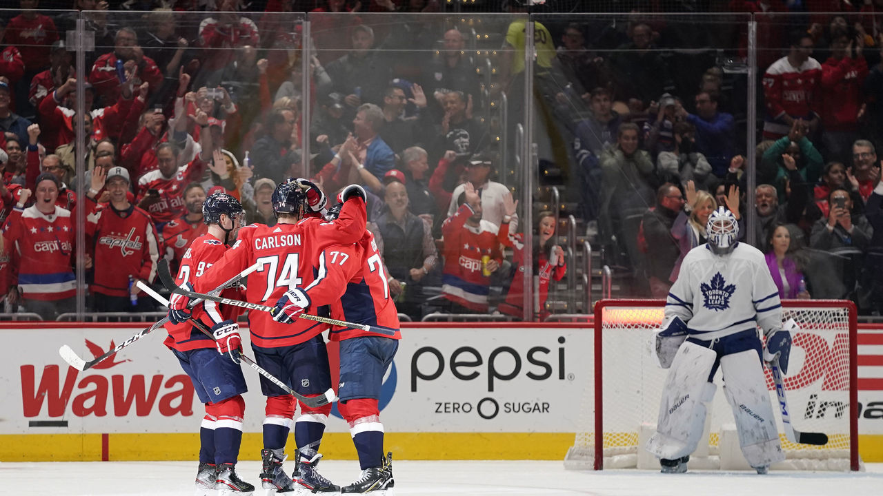 WASHINGTON, DC - OCTOBER 16: John Carlson #74 of the Washington Capitals celebrates with his teammates after scoring a goal in the second period against the Toronto Maple Leafs at Capital One Arena on October 16, 2019 in Washington, DC.