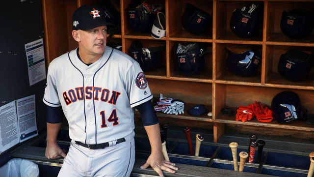 BRONX, NY - OCTOBER 15: Houston Astros manager AJ Hinch #14 looks on from the dugout prior to Game 3 of the ALCS between the Houston Astros and the New York Yankees at Yankee Stadium on Tuesday, October 15, 2019 in the Bronx borough of New York City.