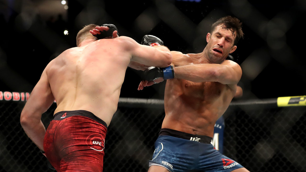 LAS VEGAS, NEVADA - JULY 06: Jan Blachowicz of Poland punches Luke Rockhold of the United States by in their UFC 239 Light Heavyweight bout at T-Mobile Arena on July 06, 2019 in Las Vegas, Nevada.