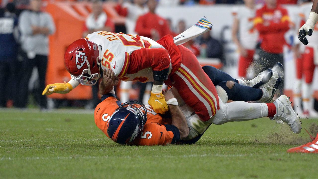 DENVER, CO - OCTOBER 17: Denver Broncos quarterback Joe Flacco (5) gets sacked by Kansas City Chiefs defensive end Frank Clark (55) during the second quarter of the game on Thursday, October 17, 2019 at Empower Field at Mile High. The Denver Broncos hosted the Kansas City Chiefs for the game. Photo by Eric Lutzens/MediaNews Group/The Denver Post via Getty Images