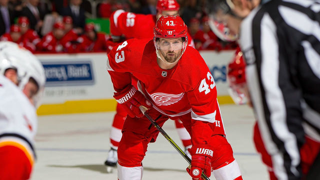 DETROIT, MI - JANUARY 02: Darren Helm #43 of the Detroit Red Wings gets set for the face-off against the Calgary Flames during an NHL game at Little Caesars Arena on January 2, 2019 in Detroit, Michigan. The Flames defeated the Red Wings 5-3.