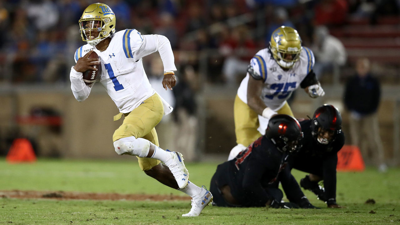 PALO ALTO, CALIFORNIA - OCTOBER 17: Dorian Thompson-Robinson #1 of the UCLA Bruins scrambles with the ball against the UCLA Bruins at Stanford Stadium on October 17, 2019 in Palo Alto, California.