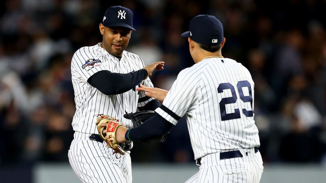 NEW YORK, NEW YORK - OCTOBER 18: Aaron Hicks #31 and Gio Urshela #29 of the New York Yankees celebrate after defeating the Houston Astros in game five of the American League Championship Series with a score of 4 to 1 at Yankee Stadium on October 18, 2019 in New York City.