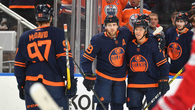 EDMONTON, AB - OCTOBER 18: Leon Draisaitl #29, Ethan Bear #74 and Connor McDavid #97 of the Edmonton Oilers celebrate after a goal during the game against the Detroit Red Wings on October 18, 2019, at Rogers Place in Edmonton, Alberta, Canada.