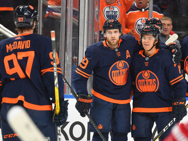 EDMONTON, AB - OCTOBER 18: Leon Draisaitl #29, Ethan Bear #74 and Connor McDavid #97 of the Edmonton Oilers celebrate after a goal during the game against the Detroit Red Wings on October 18, 2019, at Rogers Place in Edmonton, Alberta, Canada.