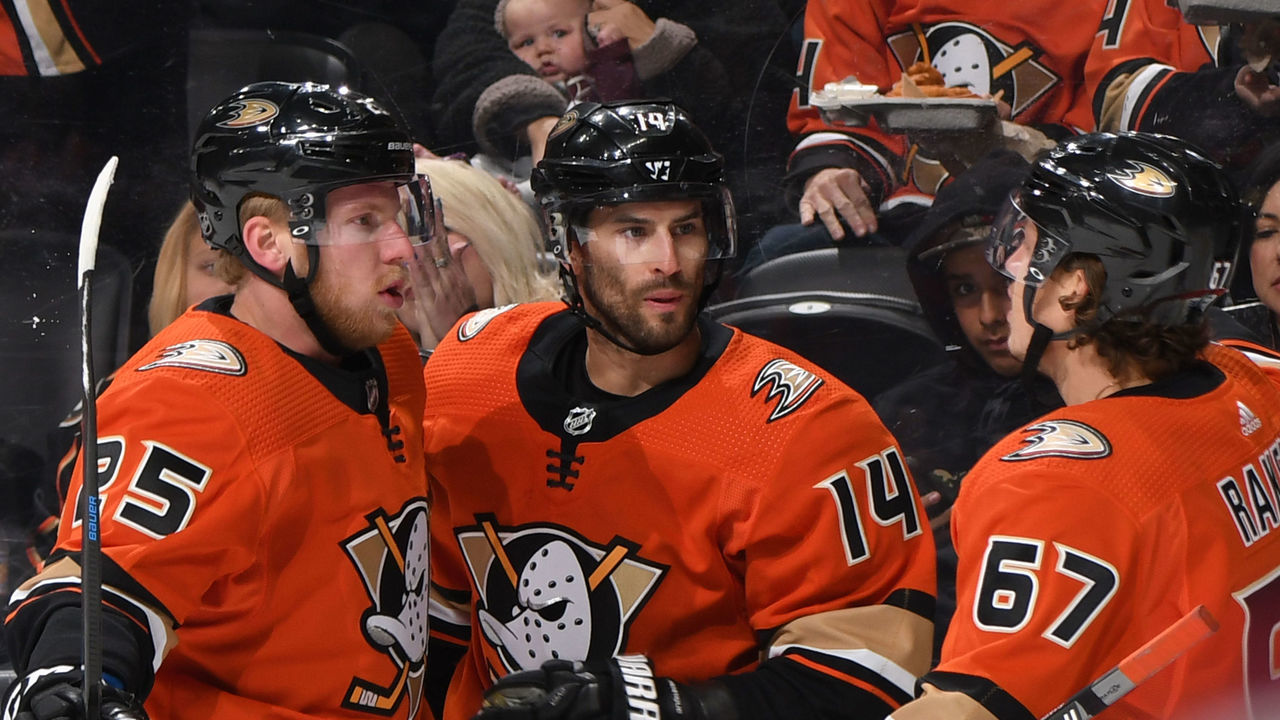 ANAHEIM, CA - OCTOBER 18: Adam Henrique #14, Ondrej Kase #25, and Rickard Rakell #67 of the Anaheim Ducks celebrate Henrique's goal in the first period of the game against the Carolina Hurricanes at Honda Center on October 18, 2019 in Anaheim, California.