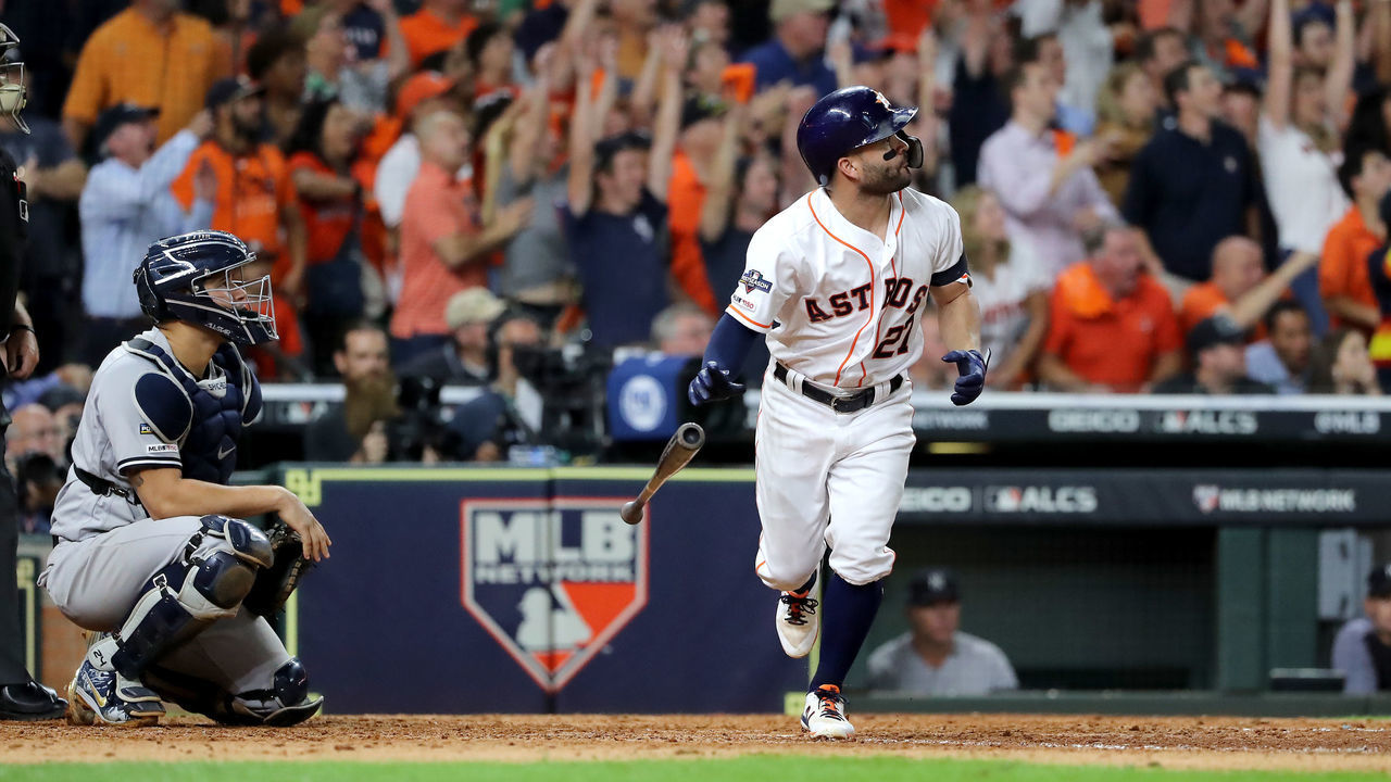 HOUSTON, TEXAS - OCTOBER 19: Jose Altuve #27 of the Houston Astros hits a walk-off two-run home run to win game six of the American League Championship Series 6-4 against the New York Yankees at Minute Maid Park on October 19, 2019 in Houston, Texas.