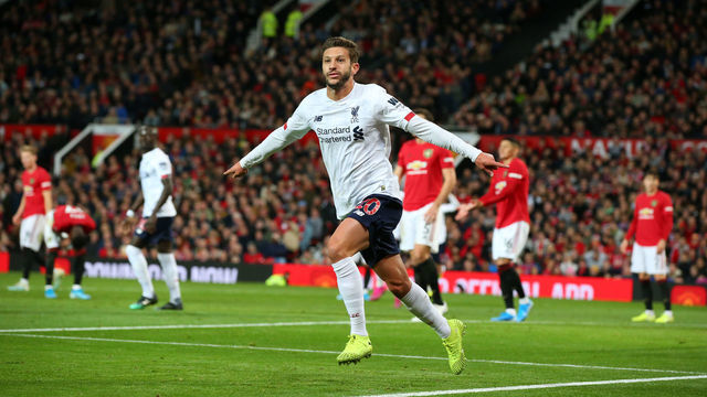 MANCHESTER, ENGLAND - OCTOBER 20: Adam Lallana of Liverpool celebrates after scoring his sides first goal during the Premier League match between Manchester United and Liverpool FC at Old Trafford on October 20, 2019 in Manchester, United Kingdom.