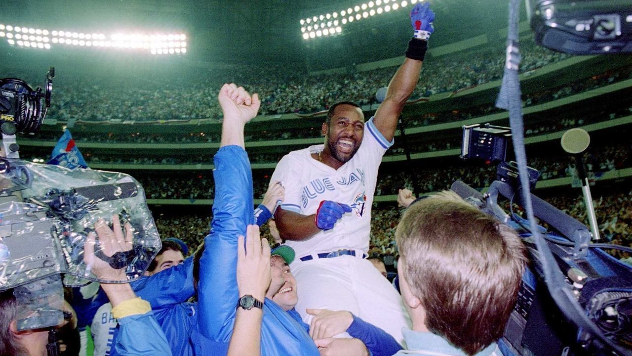 TORONTO, ON - OCTOBER 23: Joe Carter #29 of the Toronto Blue Jays is held aloft after hitting a three-run homer in the bottom of the ninth to win the World Series, four games to two, against the Philadelphia Phillies on October 23, 1993 at the Toronto Skydome in Toronto, Ontario, Canada.