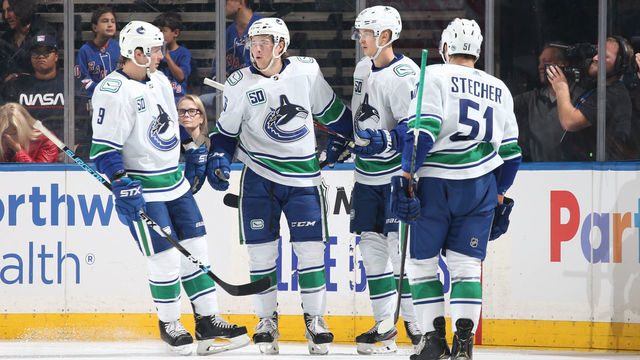NEW YORK, NY - OCTOBER 20: Brock Boeser #6 of the Vancouver Canucks celebrates with teammates after scoring a goal in the first period against the New York Rangers at Madison Square Garden on October 20, 2019 in New York City.