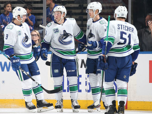 NEW YORK, NY - OCTOBER 20: Brock Boeser #6 of the Vancouver Canucks celebrates with teammates after scoring a goal in the first period against the New York Rangers at Madison Square Garden on October 20, 2019 in New York City.