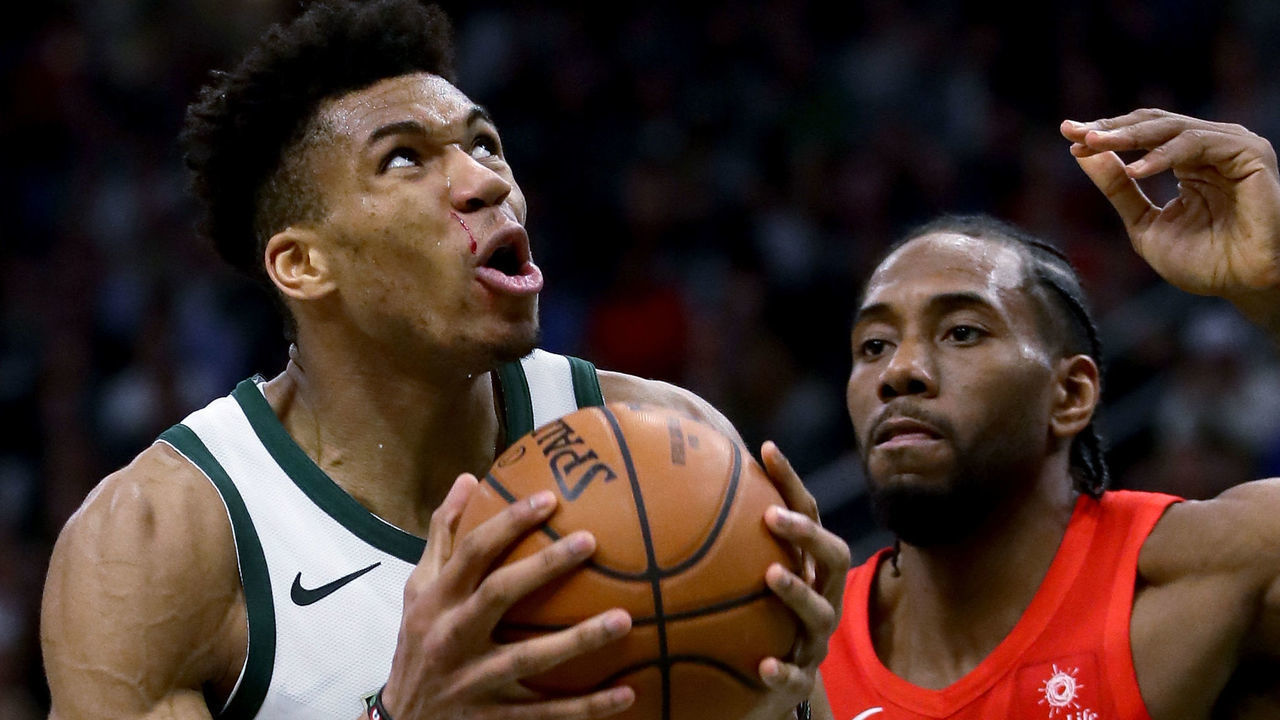 MILWAUKEE, WISCONSIN - MAY 23: Giannis Antetokounmpo #34 of the Milwaukee Bucks dribbles the ball while being guarded by Kawhi Leonard #2 of the Toronto Raptors in the third quarter during Game Five of the Eastern Conference Finals of the 2019 NBA Playoffs at the Fiserv Forum on May 23, 2019 in Milwaukee, Wisconsin.