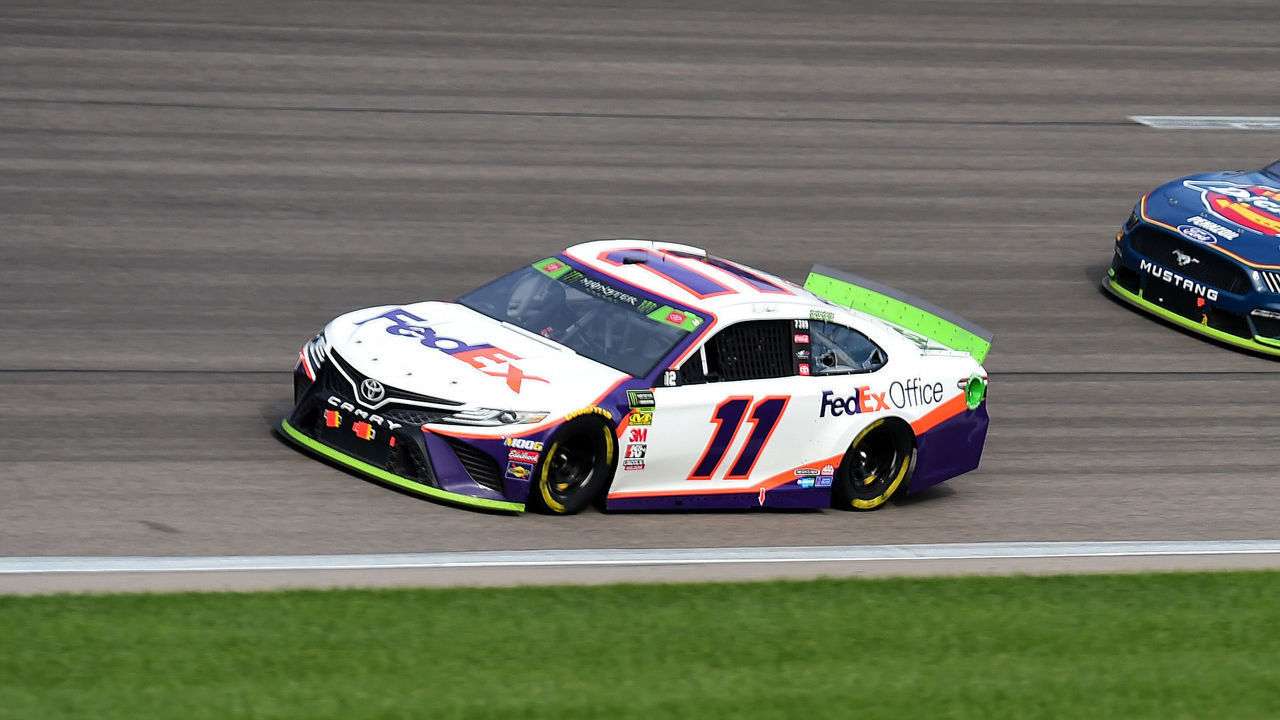 KANSAS CITY, KANSAS - OCTOBER 20: Denny Hamlin, driver of the #11 FedEx Office Toyota, leads Ryan Blaney, driver of the #12 Menards/Dickies Ford, during the Monster Energy NASCAR Cup Series Hollywood Casino 400 at Kansas Speedway on October 20, 2019 in Kansas City, Kansas.