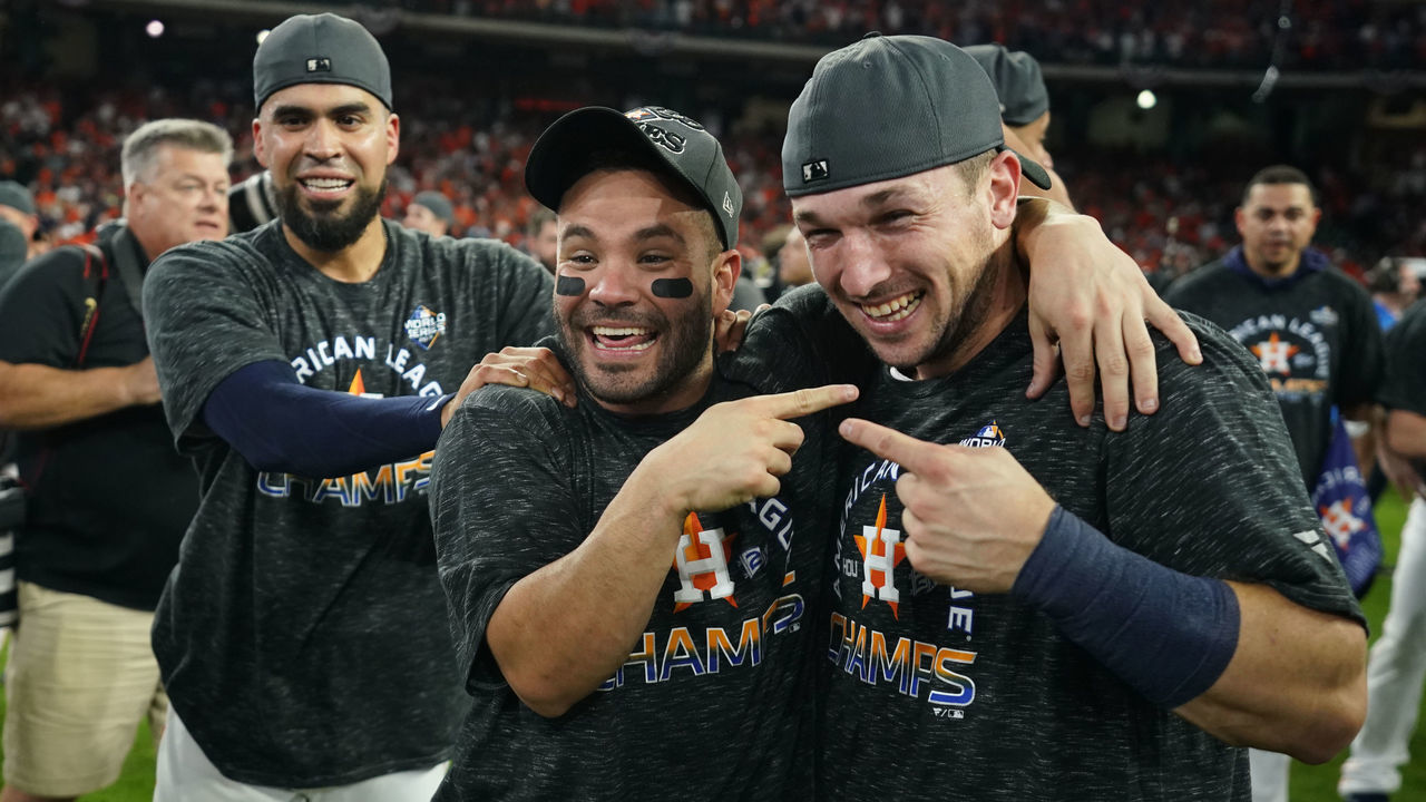 HOUSTON, TX - OCTOBER 19: Robinson Chirinos #28 Jose Altuve #27 and Alex Bregman #2 of the Houston Astros react after winning the AL pennant with a 6-4 win in Game 6 of the ALCS against the New York Yankees at Minute Maid Park on Saturday, October 19, 2019 in Houston, Texas.