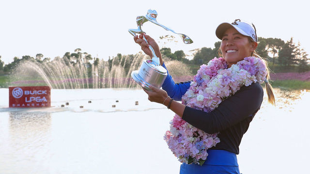 Danielle Kang of the US celebrates with her trophy after winning the Shanghai LPGA golf tournament in Shanghai on October 20, 2019.