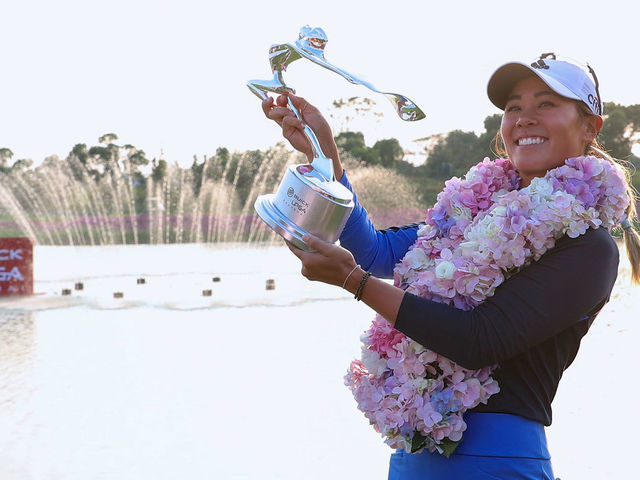 Danielle Kang of the US celebrates with her trophy after winning the Shanghai LPGA golf tournament in Shanghai on October 20, 2019.