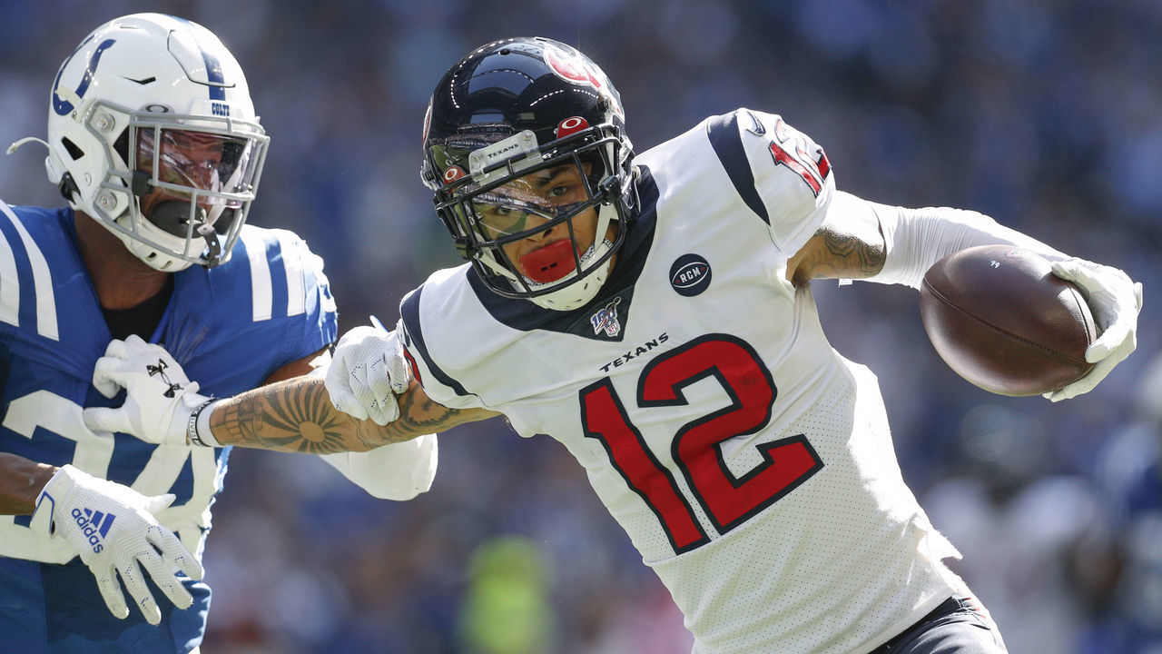 INDIANAPOLIS, IN - OCTOBER 20: Kenny Stills #12 of the Houston Texans runs the ball and tries to hold off Rock Ya-Sin #34 of the Indianapolis Colts from the tackle during the second half at Lucas Oil Stadium on October 20, 2019 in Indianapolis, Indiana.