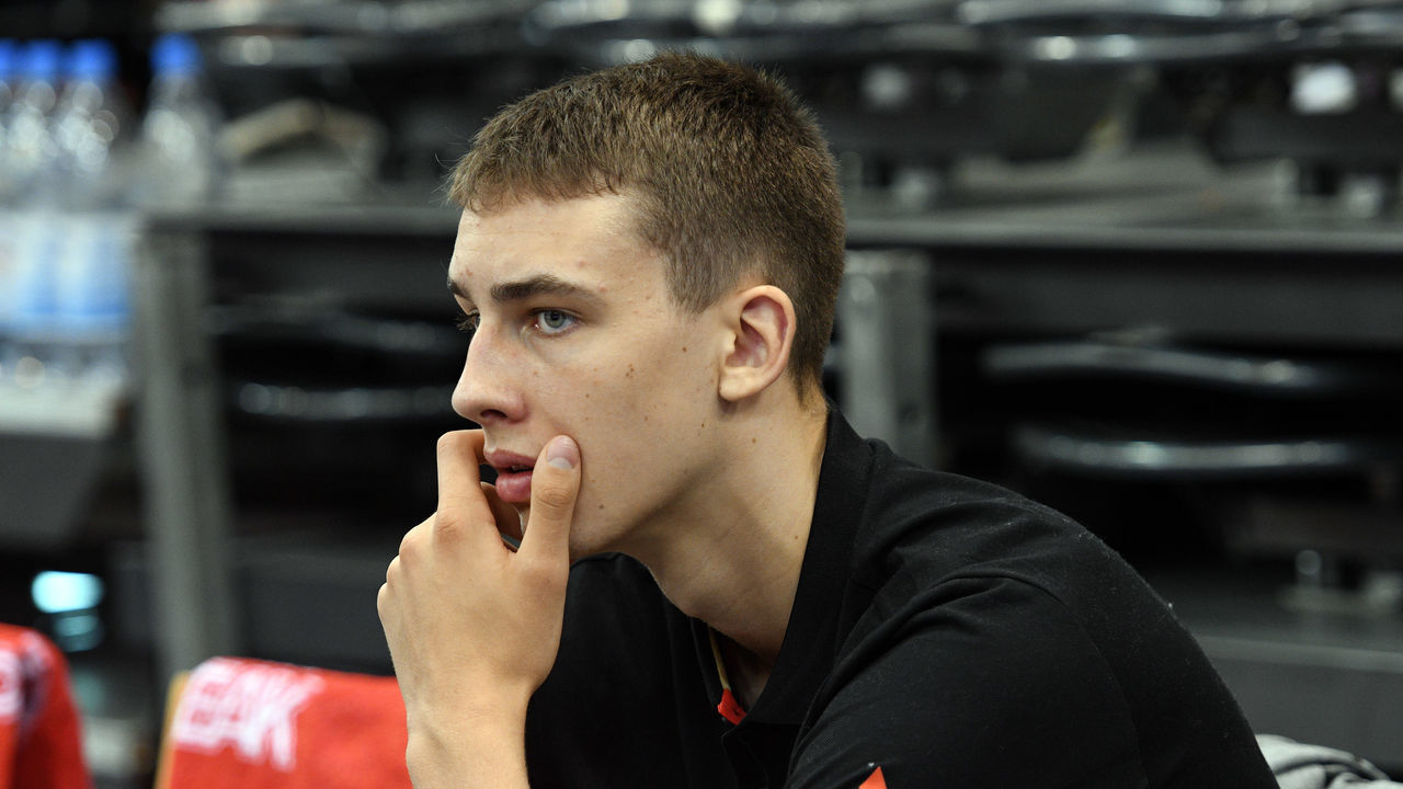 11 August 2019, Rhineland-Palatinate, Trier: Basketball: international, Germany - Sweden. Young talent Franz Wagner sits on the bench before the game. Photo: Harald Tittel/dpa