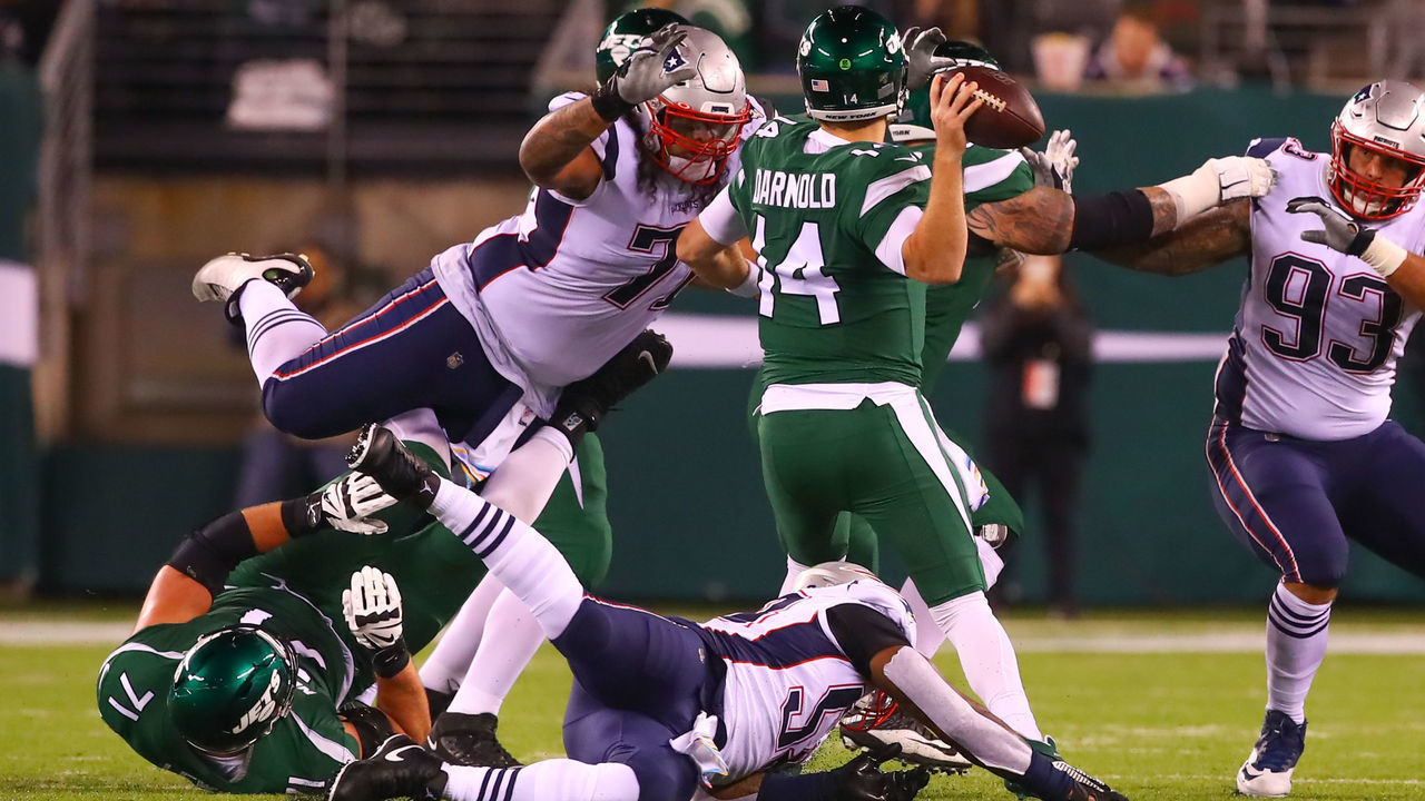 EAST RUTHERFORD, NJ - OCTOBER 21: New England Patriots defensive tackle Danny Shelton (71) pressures New York Jets quarterback Sam Darnold (14) and hits him in the head during the second quarter of the National Football League game between the New York Jets and the New England Patriots on October 21, 2019 at MetLife Stadium in East Rutherford, NJ