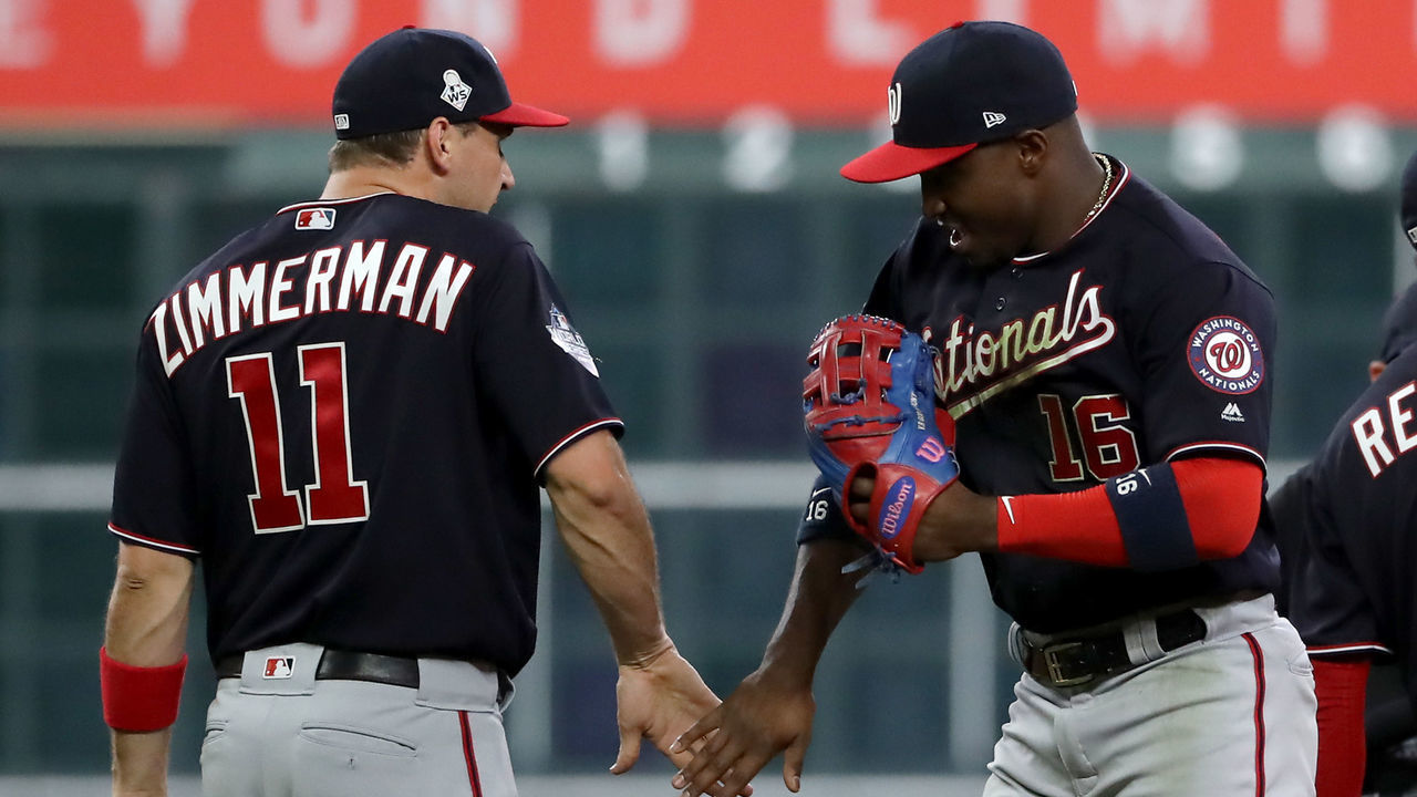 HOUSTON, TEXAS - OCTOBER 22: Ryan Zimmerman #11 and Victor Robles #16 of the Washington Nationals celebrates their teams 5-4 win over the Houston Astros in Game One of the 2019 World Series at Minute Maid Park on October 22, 2019 in Houston, Texas.