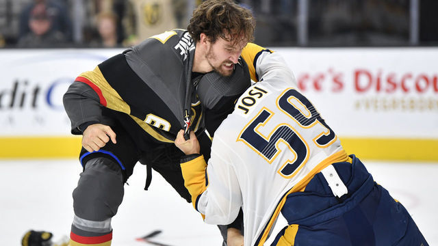 LAS VEGAS, NEVADA - OCTOBER 15: Mark Stone #61 of the Vegas Golden Knights fights Roman Josi #59 of the Nashville Predators during the first period at T-Mobile Arena on October 15, 2019 in Las Vegas, Nevada.