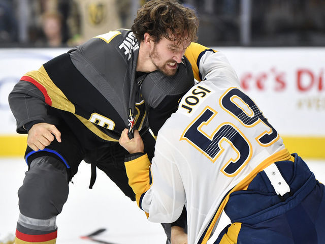 LAS VEGAS, NEVADA - OCTOBER 15: Mark Stone #61 of the Vegas Golden Knights fights Roman Josi #59 of the Nashville Predators during the first period at T-Mobile Arena on October 15, 2019 in Las Vegas, Nevada.