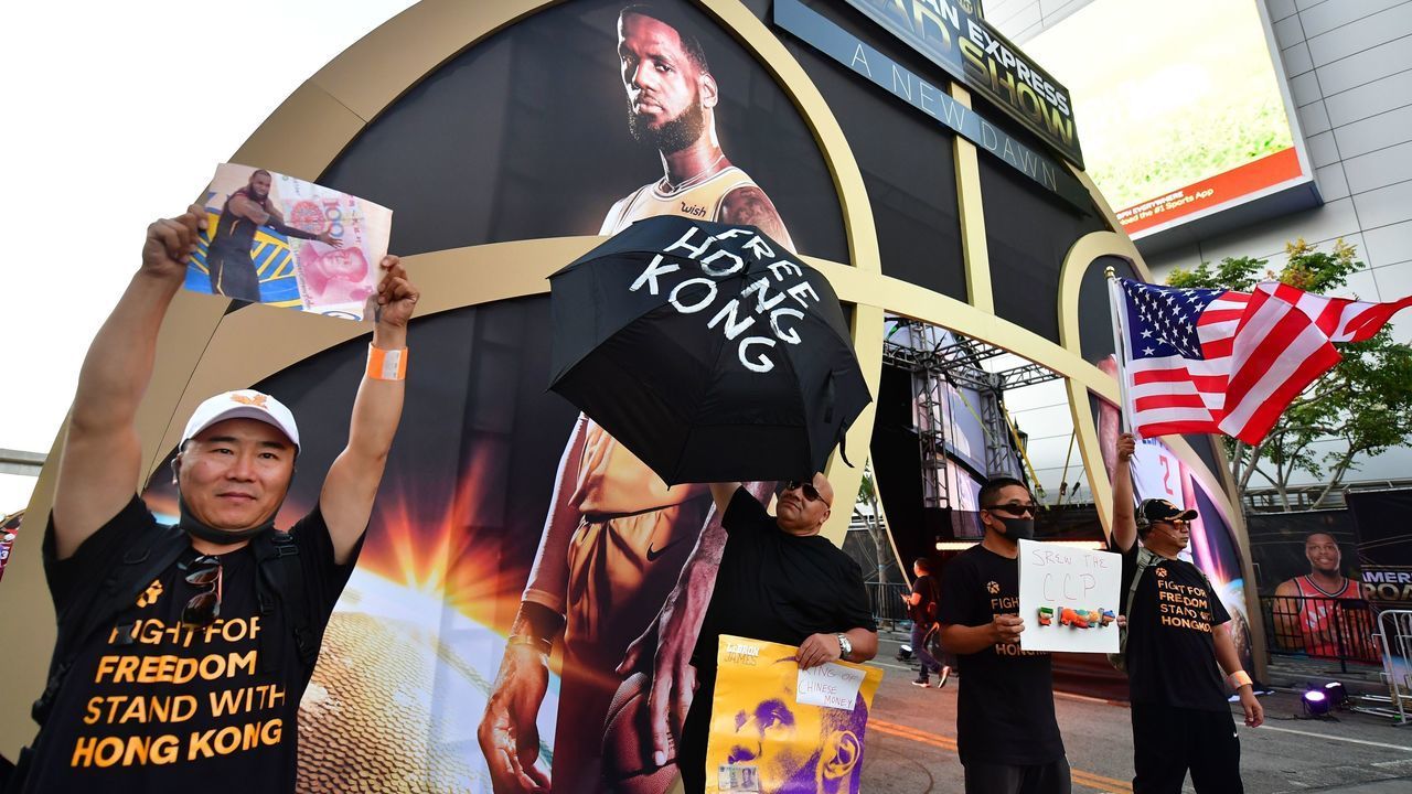 Hong Kong supporters protest outside Staples Center ahead of the Lakers vs Clippers NBA season opener in Los Angeles on October 22, 2019. - Activists handed out free T-shirts displaying support for the Hong Kong protests after an NBA fan in Northern California raised enough money to pay for more than 10,000 shirts, according to the organizer who goes by the pseudonym "Sun Lared" as LeBron James of the Lakers suffers the brunt of people's anger after comments he made in response to the tweet from Houston Rockets GM Daryl Morey in support of Hong Kong protesters, and drawing the ire of the Chinese Communist Pary.