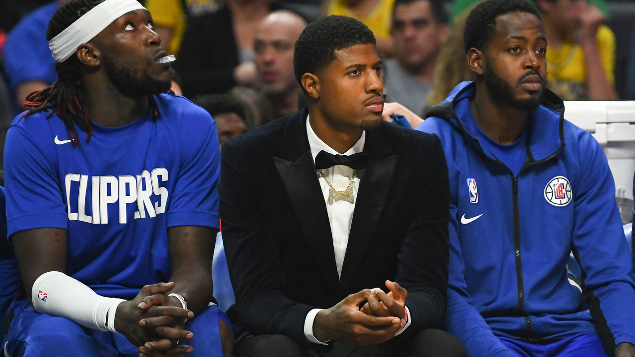 LOS ANGELES, CA - OCTOBER 22: Los Angeles Clippers Guard Lou Williams (23), Los Angeles Clippers Center Montrezl Harrell (5), Los Angeles Clippers Guard Paul George (13) and Los Angeles Clippers Forward JaMychal Green (4) look on from the bench during a NBA game between the Los Angeles Lakers and the Los Angeles Clippers on October 22, 2019 at STAPLES Center in Los Angeles, CA.