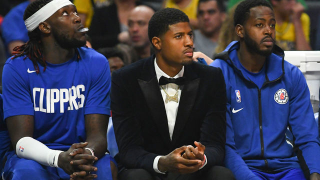 LOS ANGELES, CA - OCTOBER 22: Los Angeles Clippers Guard Lou Williams (23), Los Angeles Clippers Center Montrezl Harrell (5), Los Angeles Clippers Guard Paul George (13) and Los Angeles Clippers Forward JaMychal Green (4) look on from the bench during a NBA game between the Los Angeles Lakers and the Los Angeles Clippers on October 22, 2019 at STAPLES Center in Los Angeles, CA.